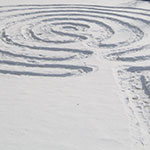 labyrinths made out of snow in the winter/grass in the summer that provide people a path to the sacred